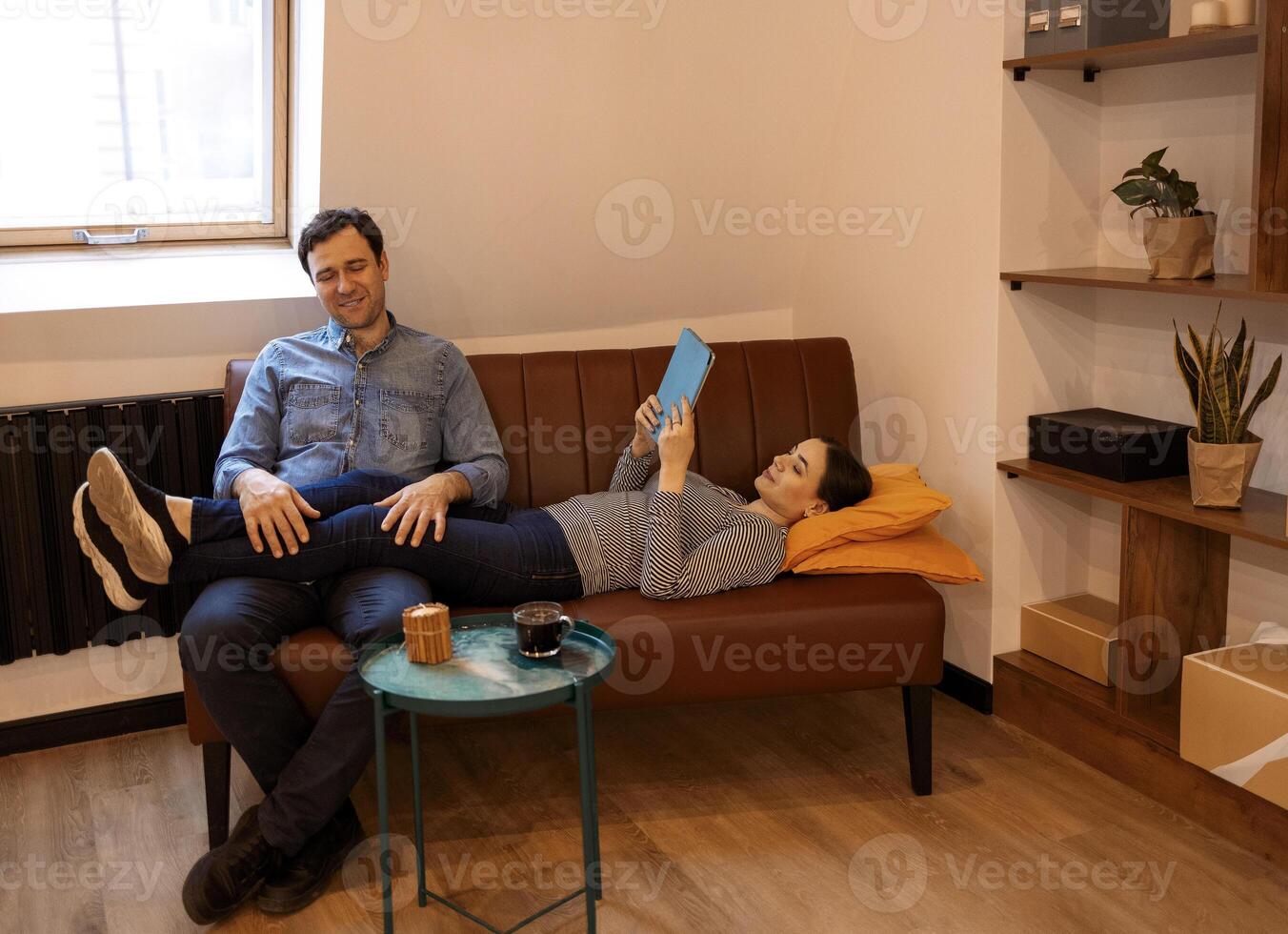 Man and woman chatting on social networking site while. photo