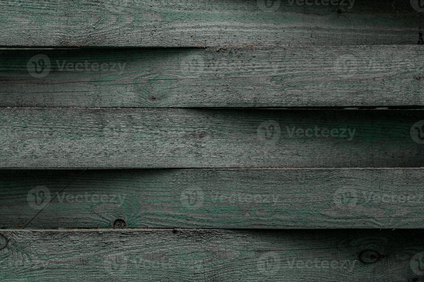 A fence made of planks. Blackboard background. Dark green background photo