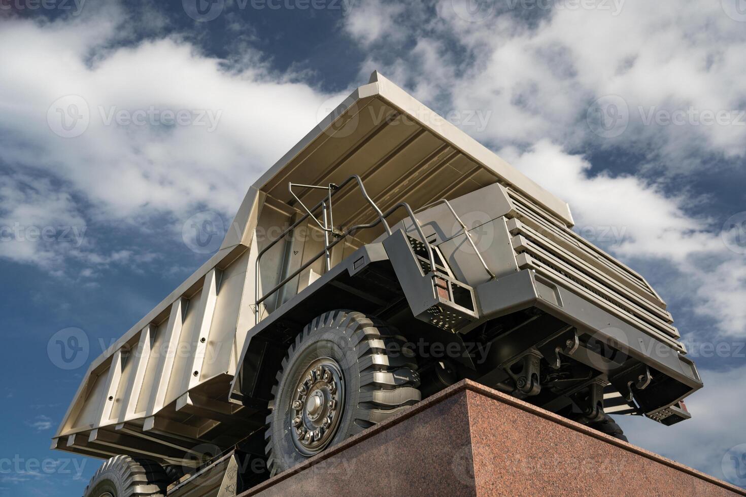 A statue of a huge, quarry dump truck in the city photo