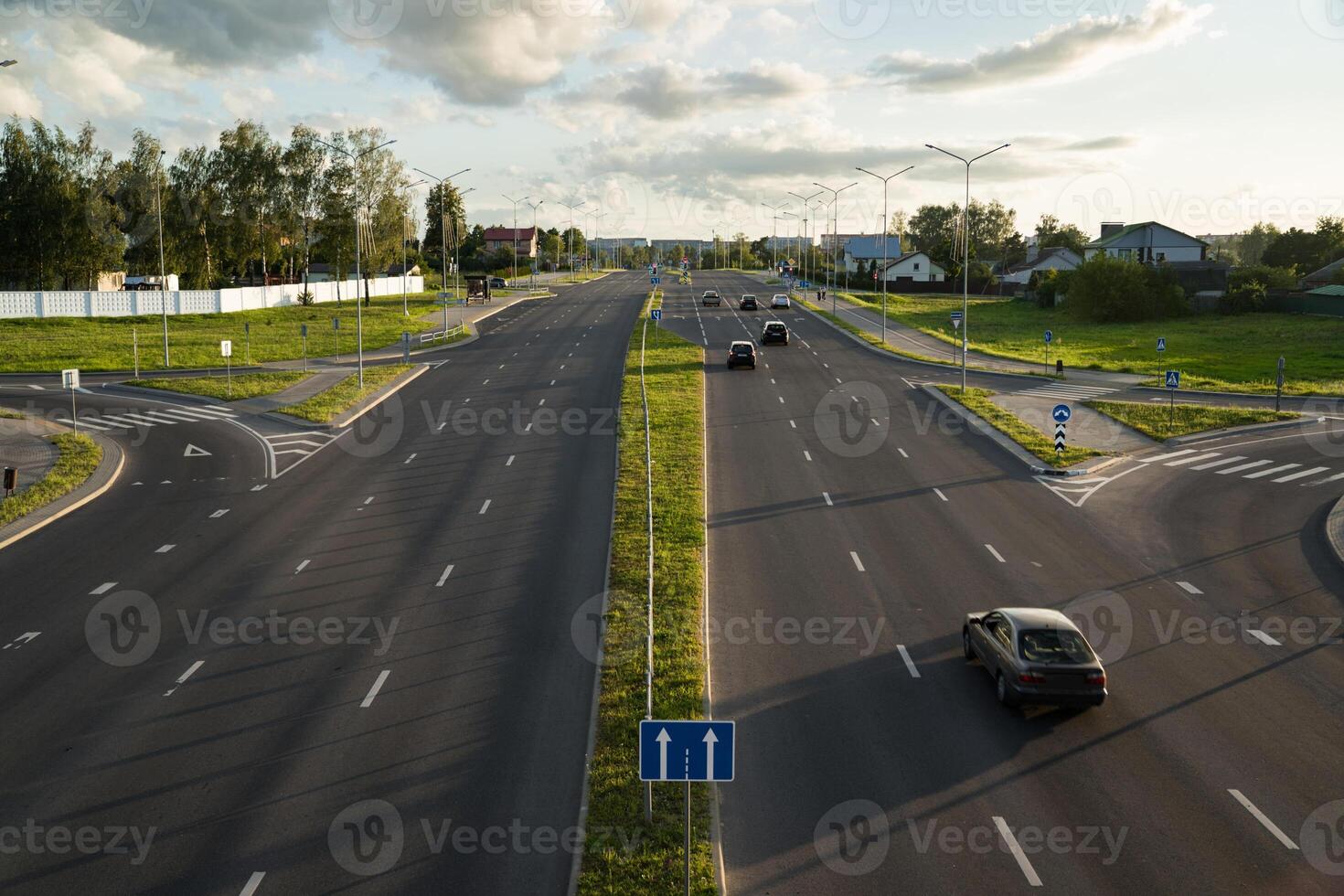 Highway in the evening view from the bridge down. Evening city, motorway photo
