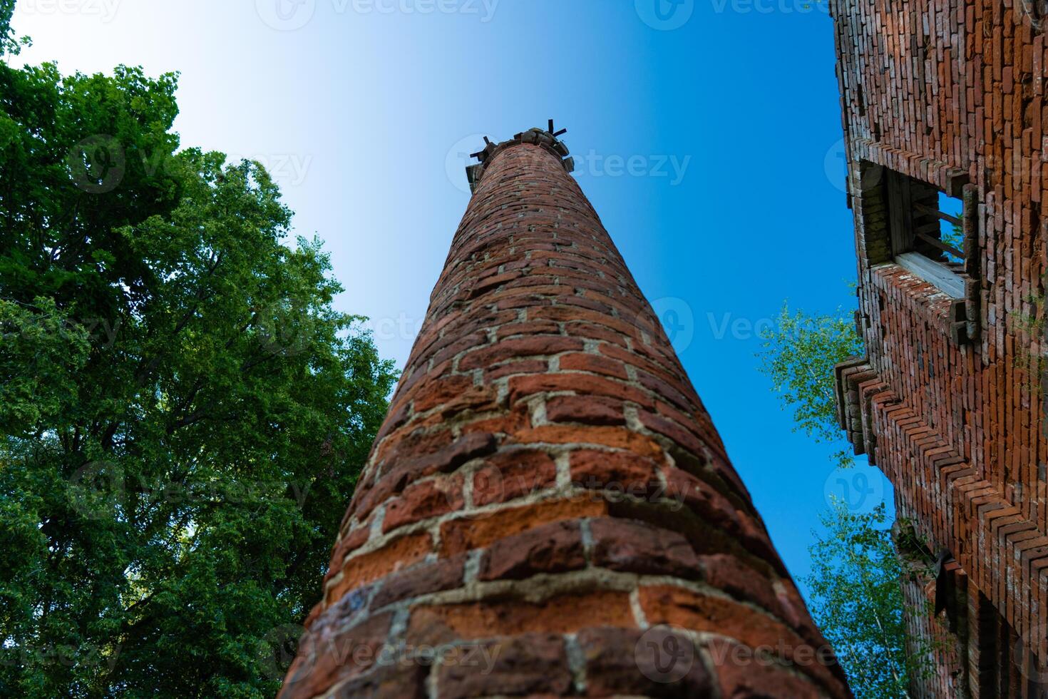 Old, brick column, bottom-up view photo