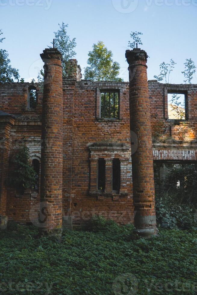 Destroyed columns. A ruined red brick stable. The Kostrovitsky manor house photo