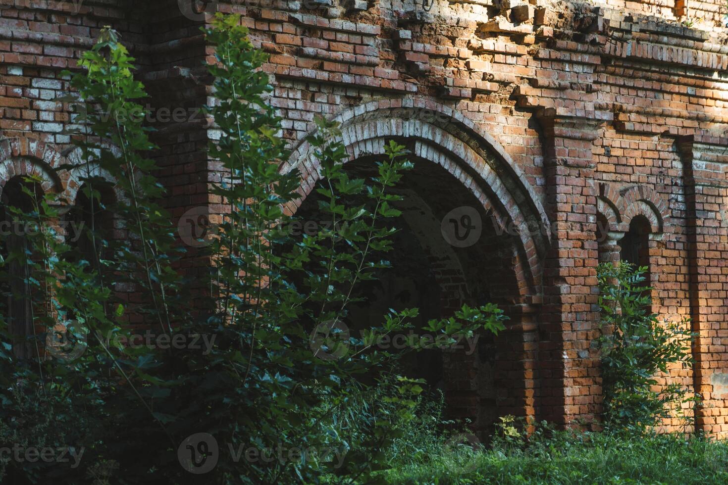 The gate to the stable. A ruined red brick stable. 19th century buildings photo