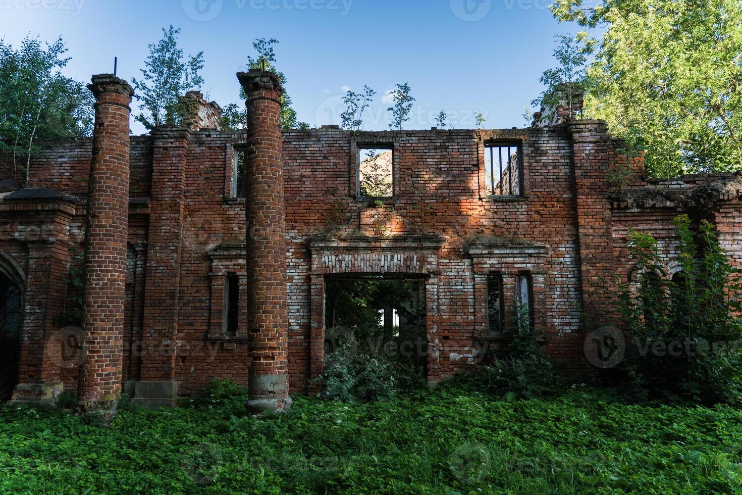 2 Columns at the entrance. Ruined red brick stable. The Kostrovitsky manor house photo