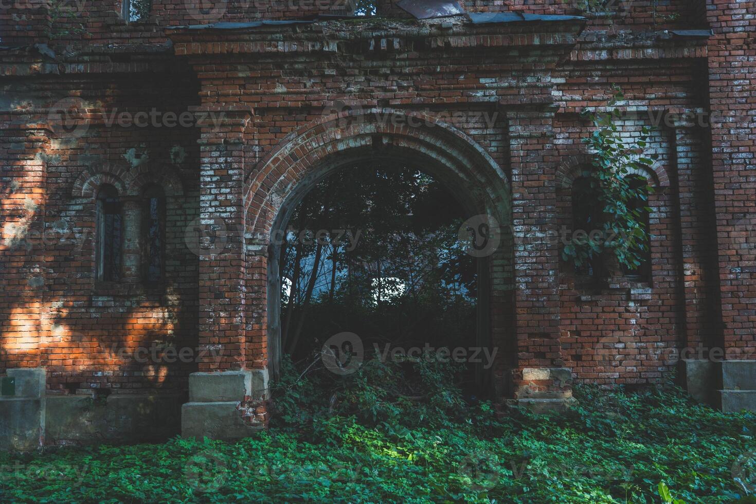 The gate to the stable. A ruined red brick stable. 19th century buildings photo
