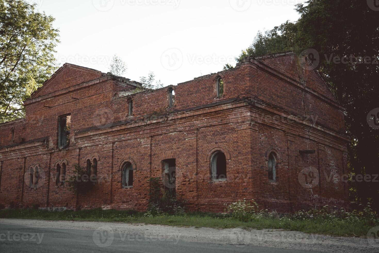 A dilapidated brick stable building. 19th century buildings photo