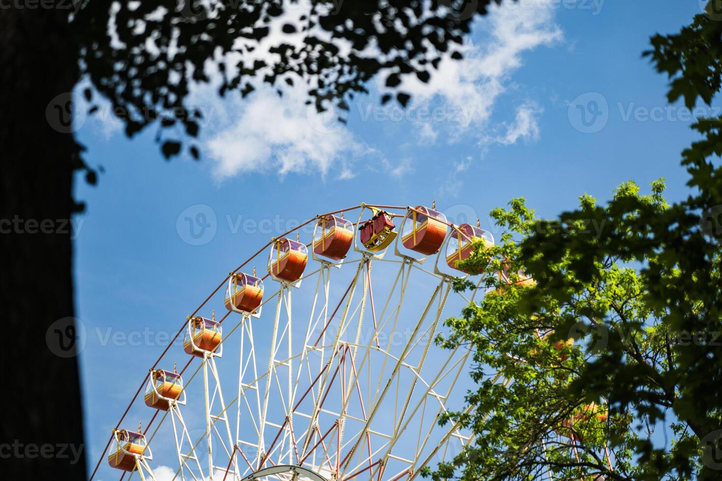 Ferris wheel in Gorky Park, view through the trees photo