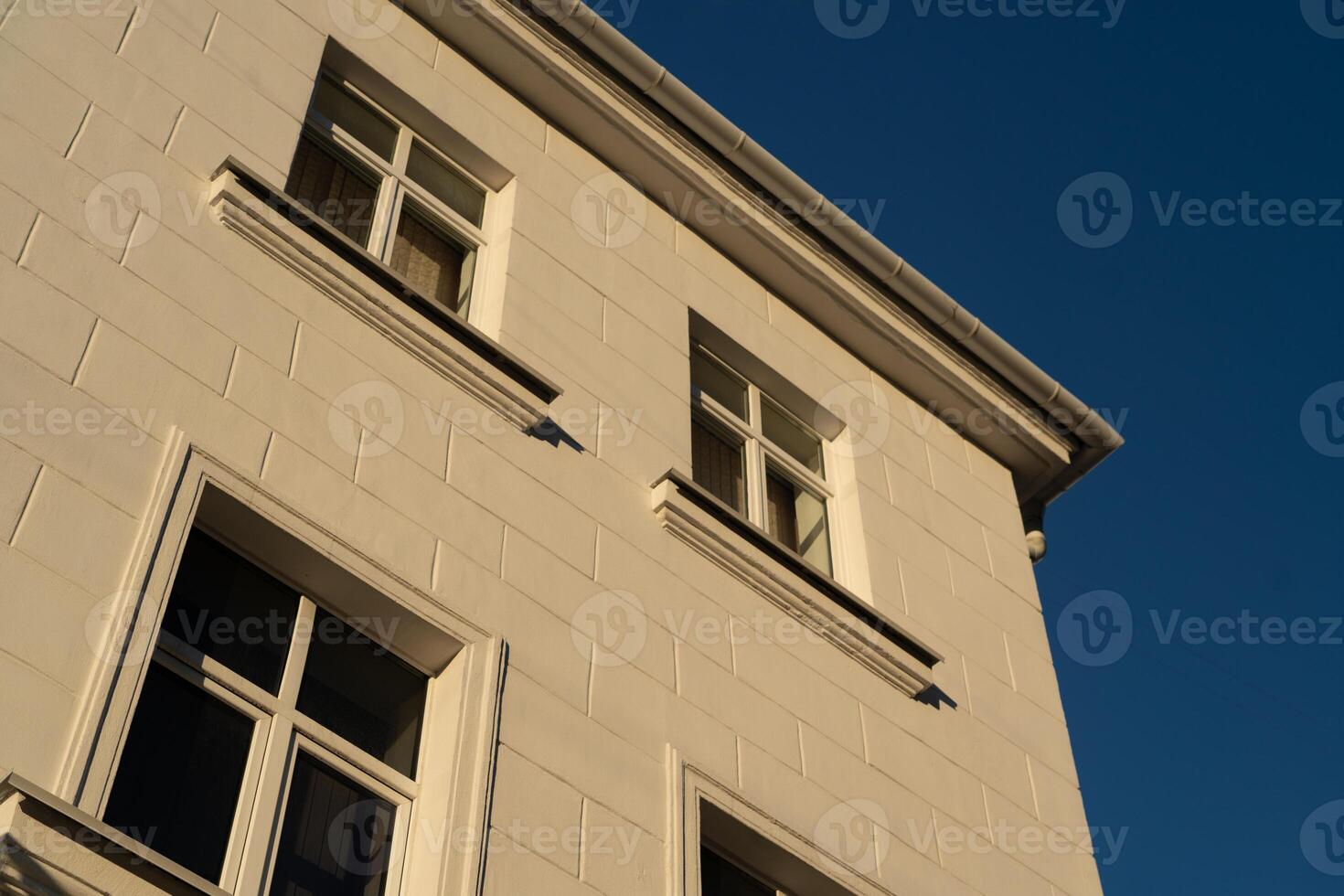 An old, vintage brick building with a view of the evening, clear sky photo