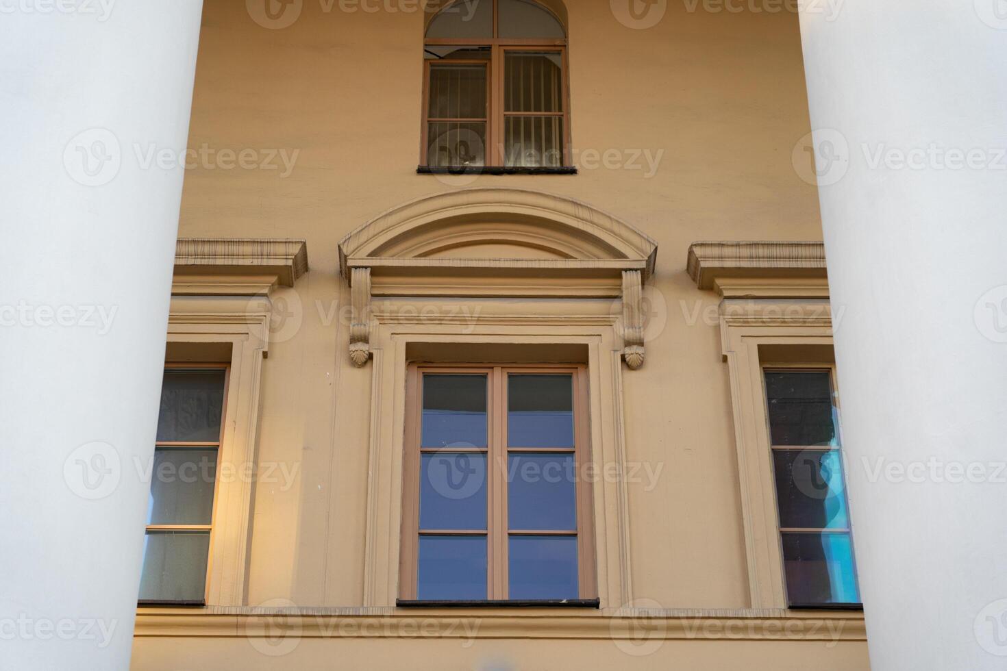 Vintage, old building. Windows between the columns. Framing photo