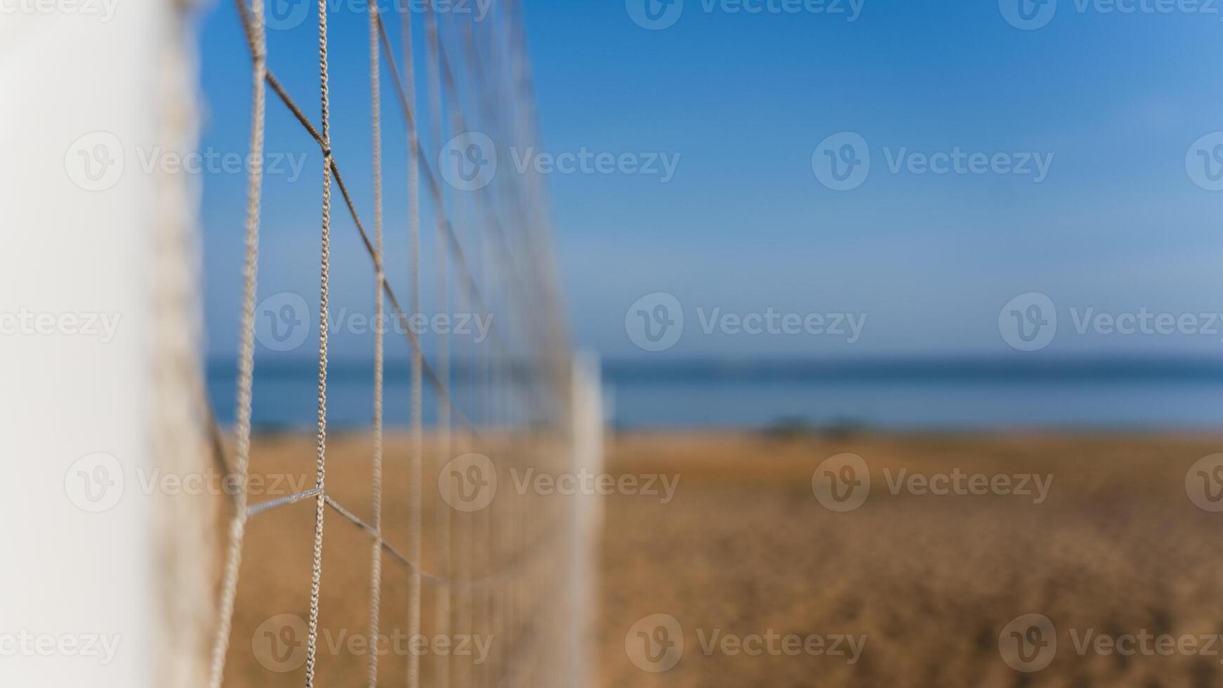 Volleyball net on the lake beach. Volleyball court on the beach photo