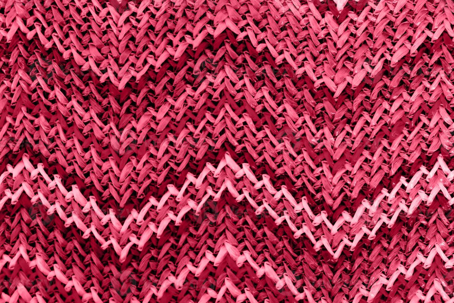 a red and pink knit pattern with a zigzag pattern photo