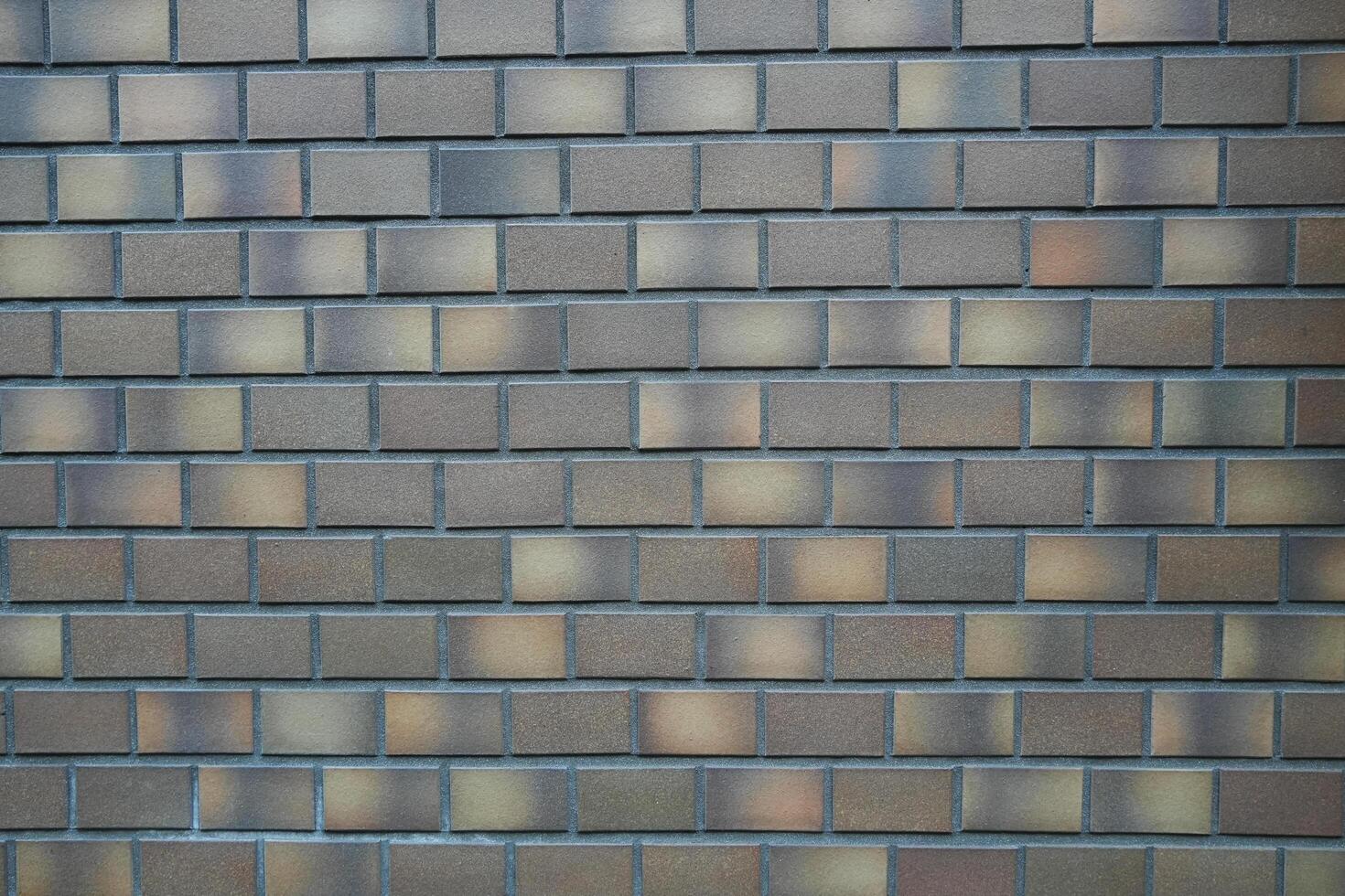 Gray brick wall texture background of building photo