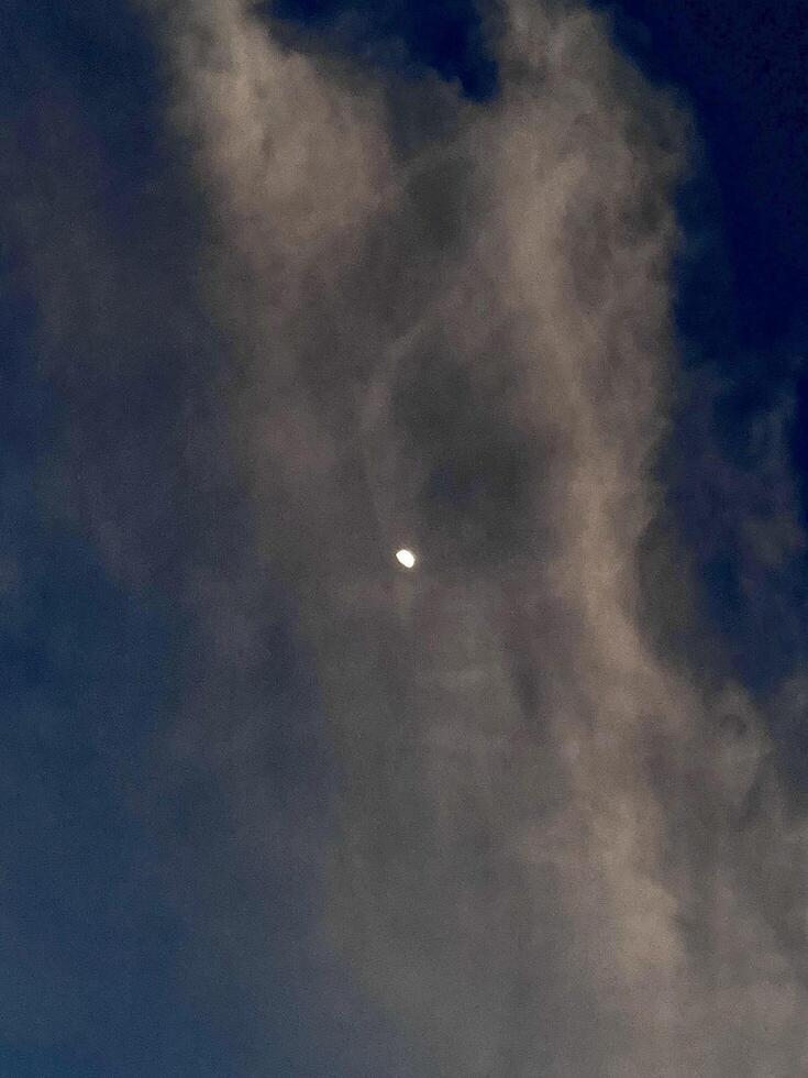 Moon in dark sky photo