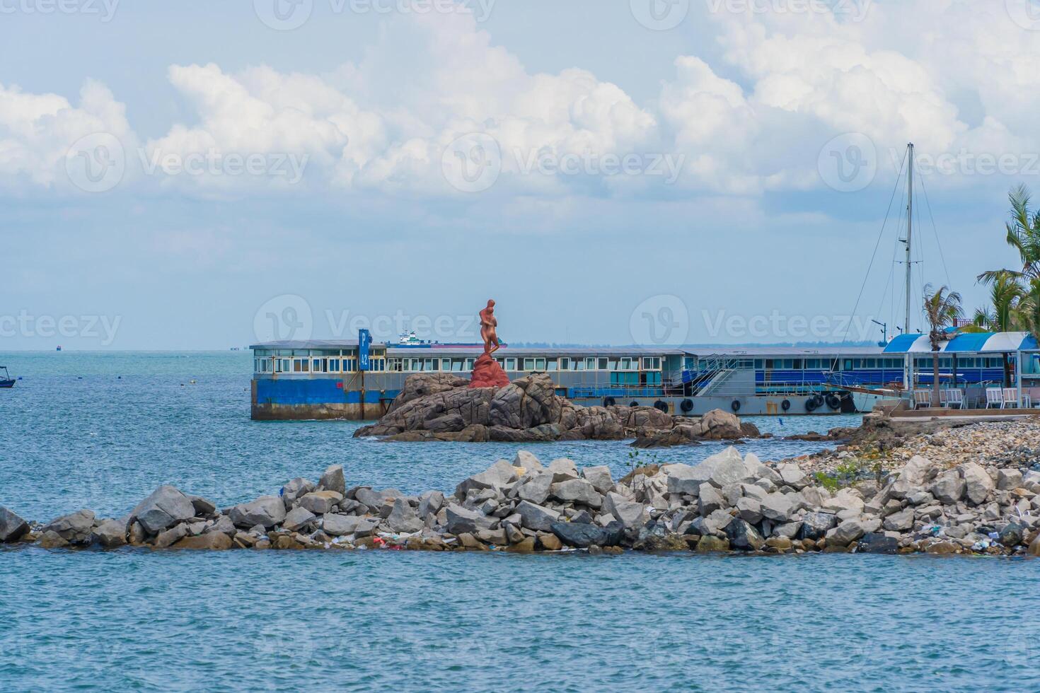 Panoramic coastal Vung Tau view, with waves, coastline, streets, coconut trees and Tao Phung mountain in Vietnam. Travel concept photo