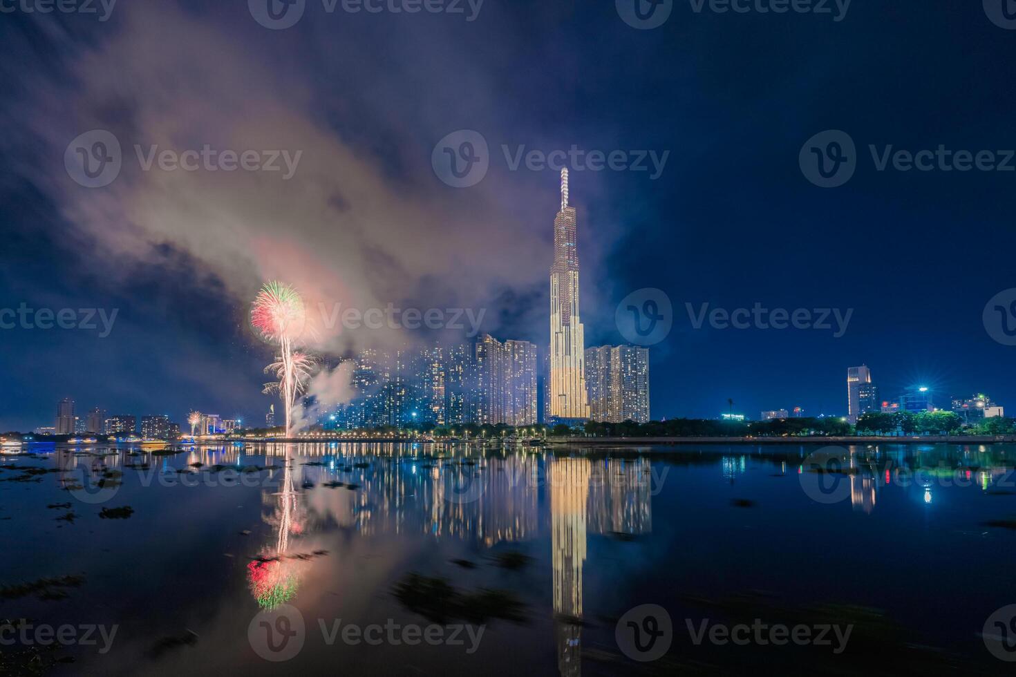 Celebration. Aerial view of fireworks lighting up the commercial district sky in Ho Chi Minh City Saigon, Vietnam. Beautiful cityscape at night. Holidays, New Year photo