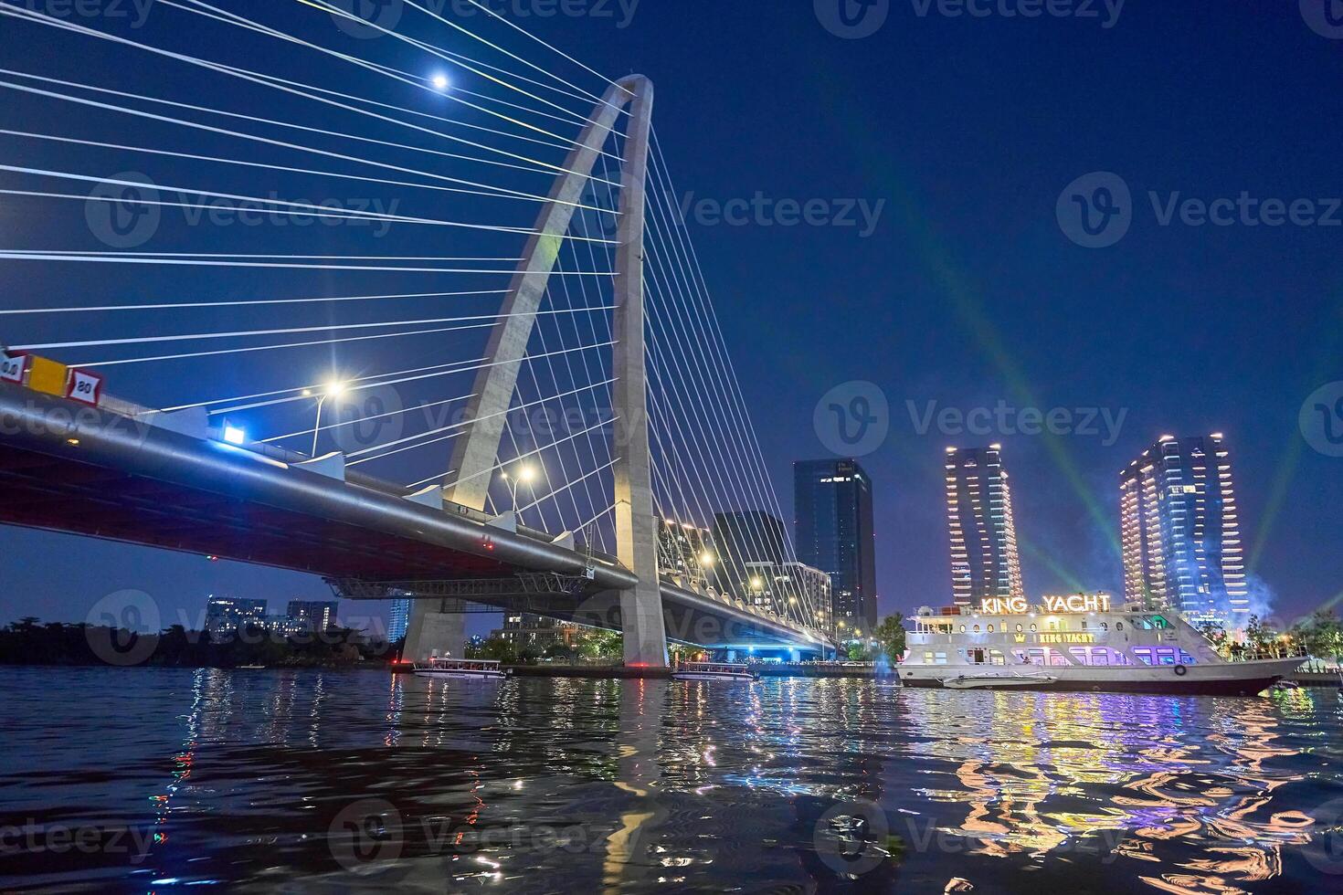 Hochiminh city, Jan 1, 2024 Ho Chi Minh City skyline and the Saigon River. Amazing colorful night view of skyscraper and other modern buildings at downtown. Travel concept photo