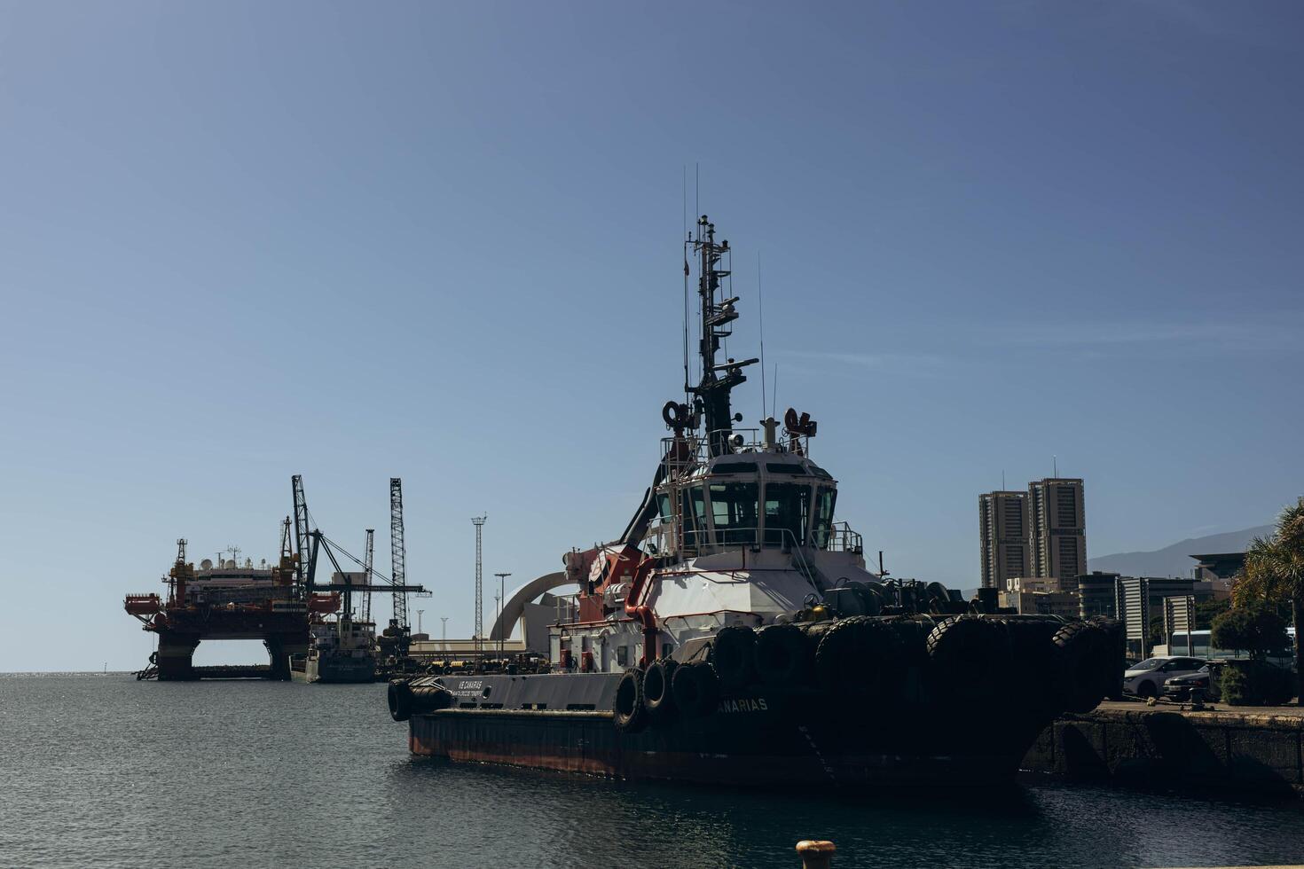 Canary Islands, Tenerife-December 19,2023. Tugboat after mooring operation in port of Santa Cruz de Tenerife photo