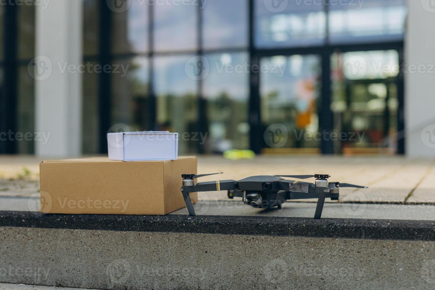 Modern technological delivery innovation - drone fast delivery concept, two multicopters and box photo