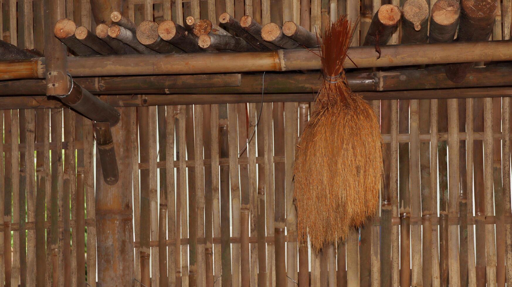 corn and rice hanging in a traditional Javanese kitchen photo