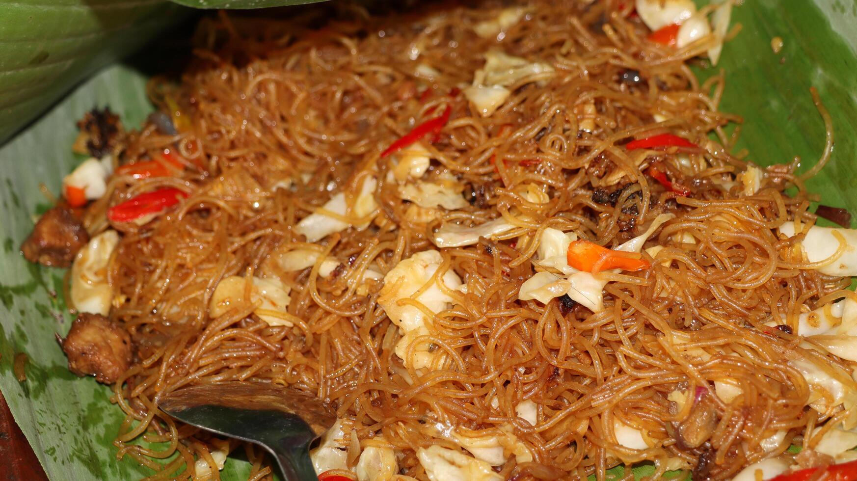 Bihun goreng rice vermicelli with vegetables and chili photo