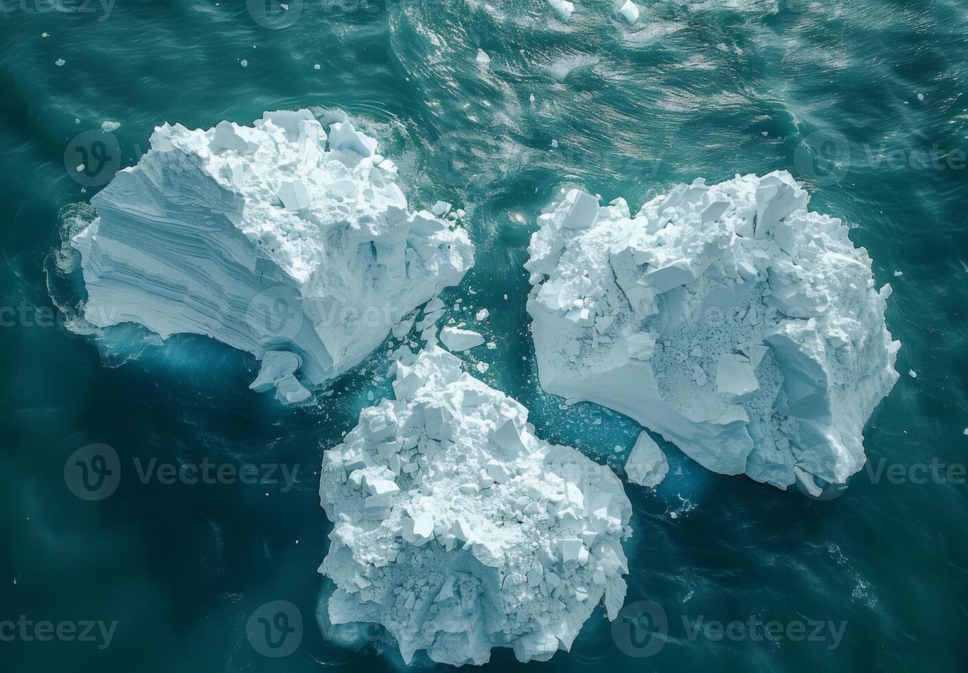 A detailed view of melting icebergs breaking apart and floating in the sea photo