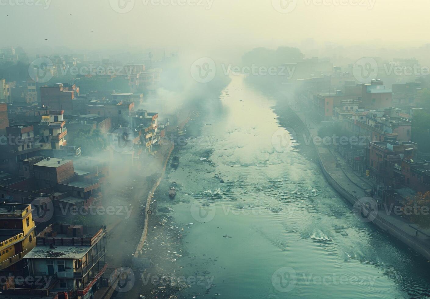A polluted river flowing through a city with smog hovering above photo