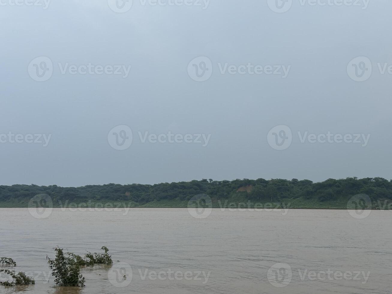 A calm river flowing in monsoon photo