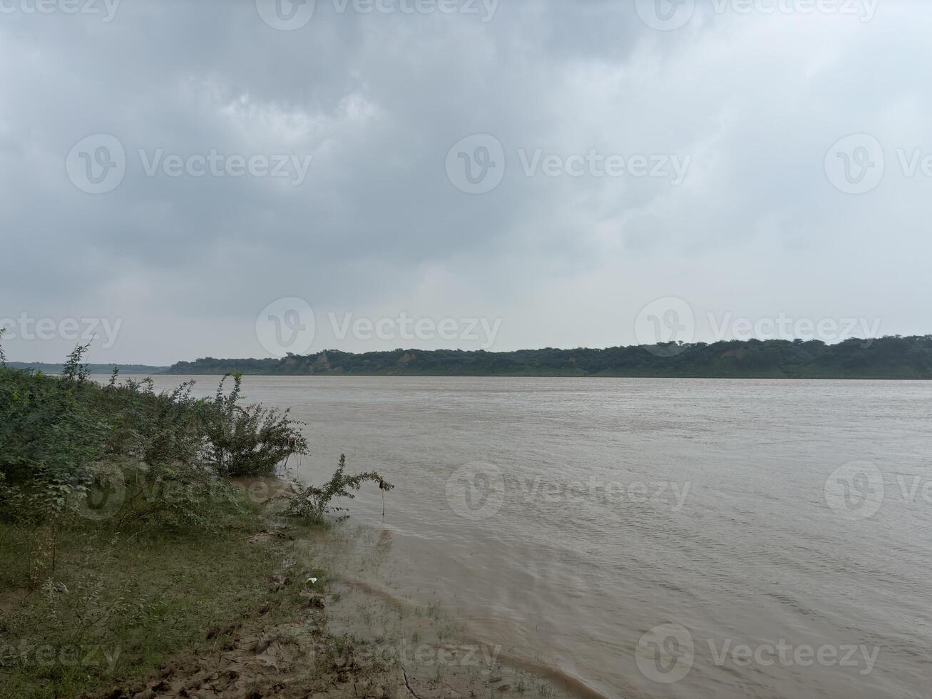 A calm river flowing naturally in monsoon photo