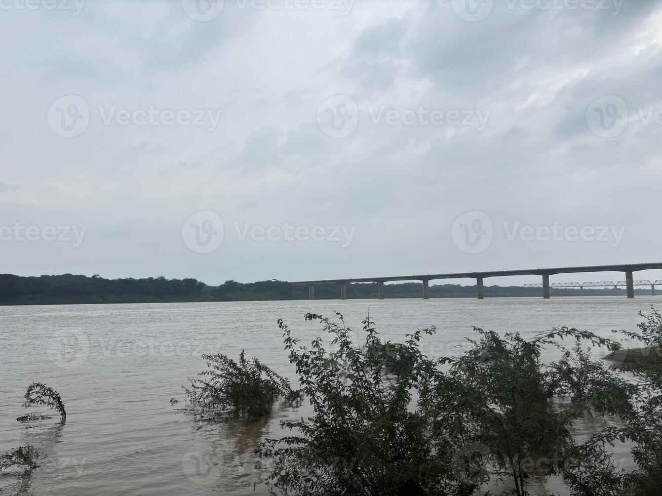 A calm river flowing naturally in monsoon season photo