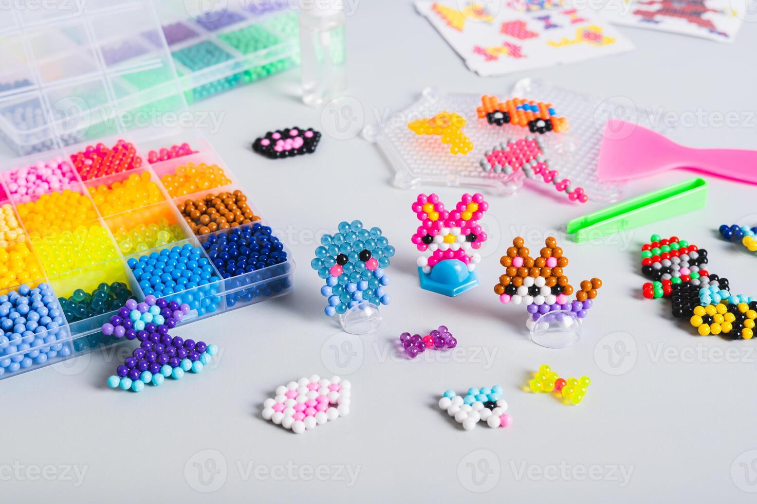 A set of aqua beads for the development of fine motor skills of children and the creation of decor photo
