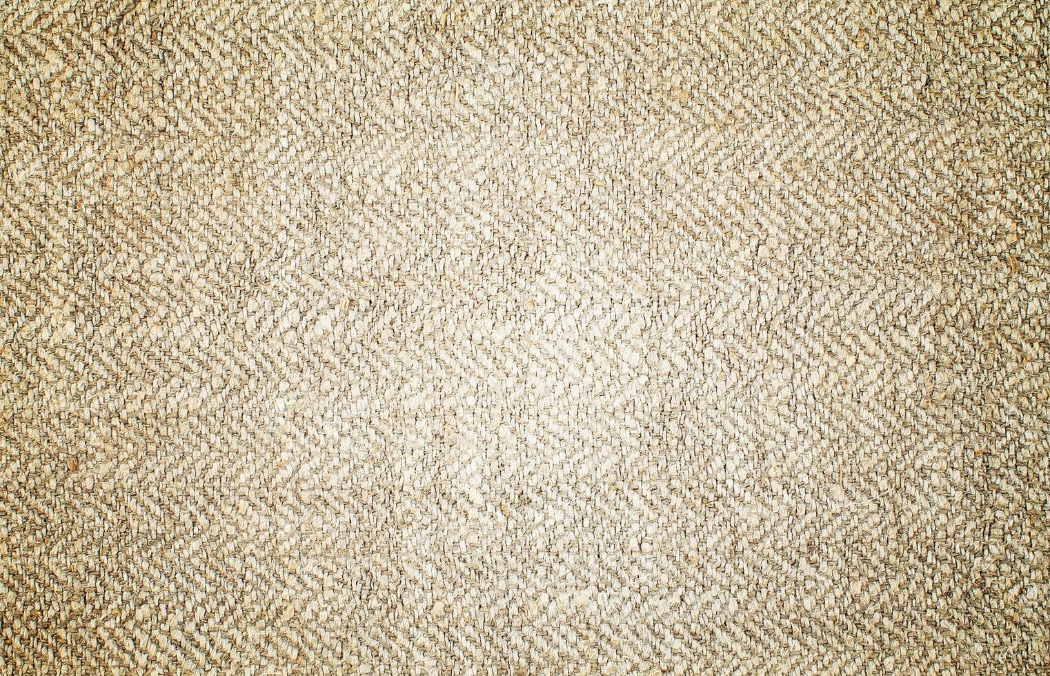 Natural Linen Material Textile Canvas Fabric Texture Background Close-up Detail of Fabric Natural Color Hemp Material Pattern Design Wallpaper. Can be Used as Background or For Graphic Design photo