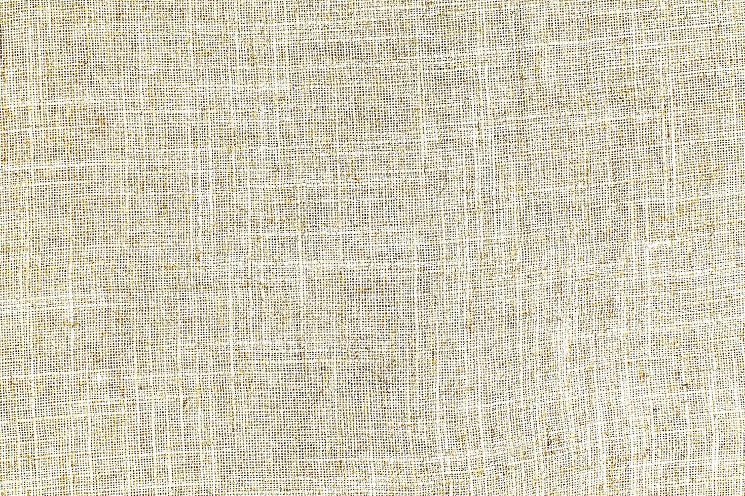 Natural Linen Material Textile Canvas Fabric Texture Background Close-up Detail of Fabric Natural Color Hemp Material Pattern Design Wallpaper. Can be Used as Background or For Graphic Design photo