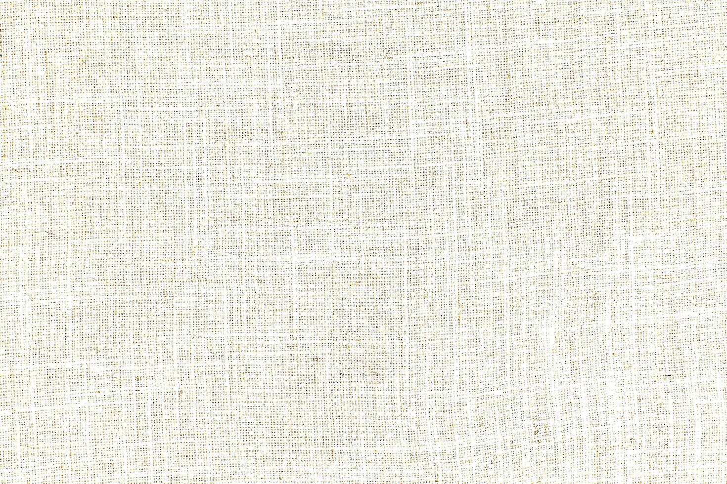 Natural Linen Material Textile Canvas Fabric Texture Background Close-up Detail of Fabric Natural Color Hemp Material Pattern Design Wallpaper. Can be Used as Background or For Graphic Design photo