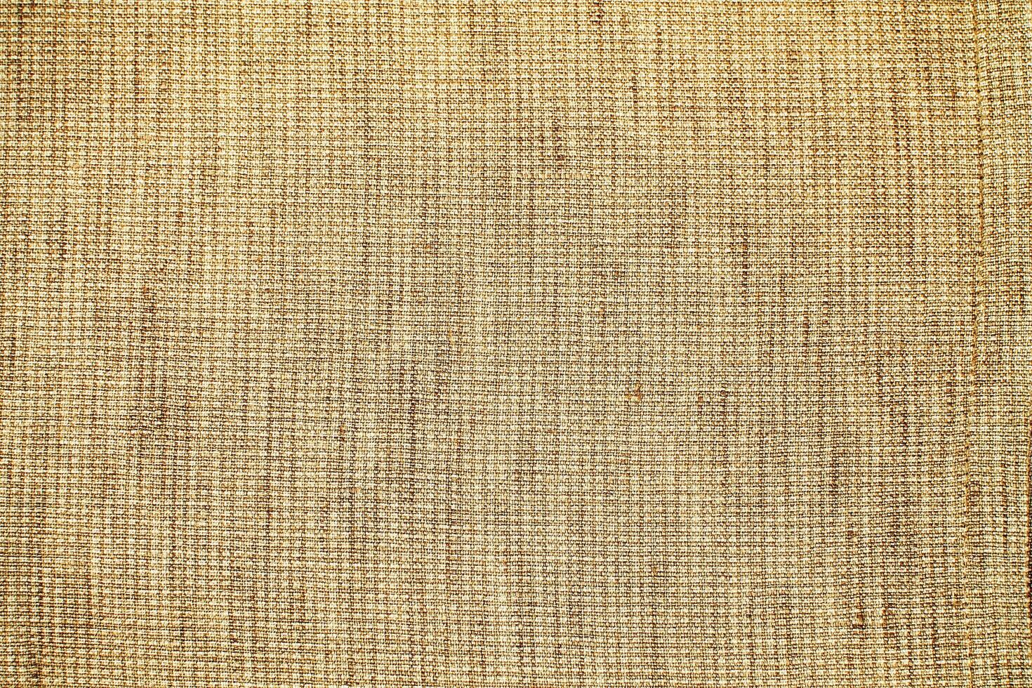 Natural Linen Material Textile Canvas Fabric Texture Background Close-up Detail of Fabric Natural Color Hemp Material Pattern Design Wallpaper. Can be Used as Background or For Graphic Design photo