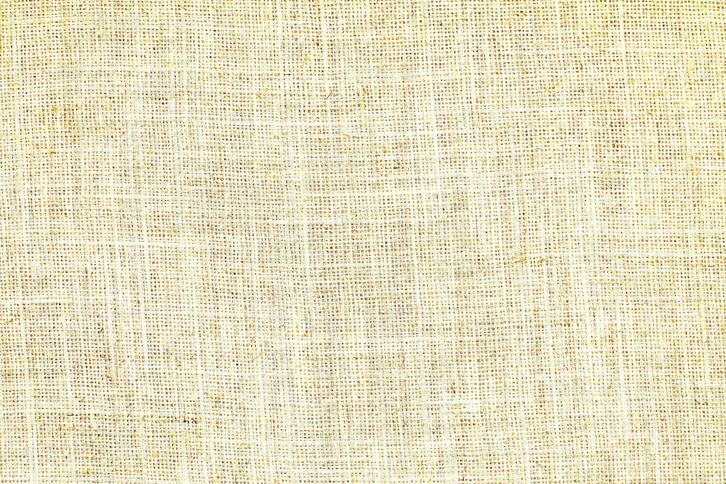 Natural Linen Material Textile Canvas Fabric Texture Background Close-up Detail of Fabric Natural Color Hemp Material Pattern Design Wallpaper. Can be Used as Background or For Graphic Design photo