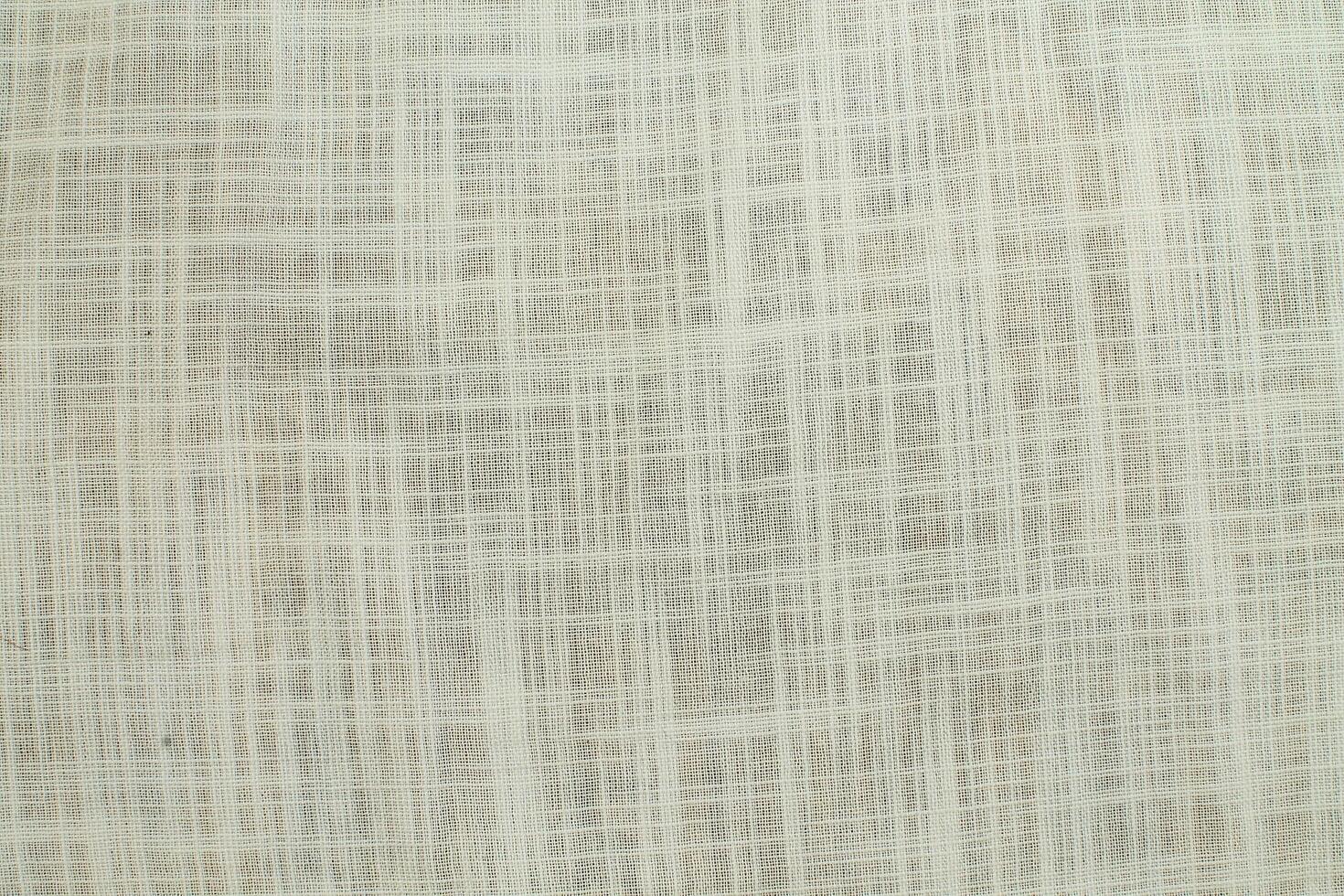 Natural Linen Material Textile Canvas Fabric Texture Background Close-up Detail of Fabric Natural Color Hemp Material Pattern Design Wallpaper. Can be Used as Background or For Graphic Design photo