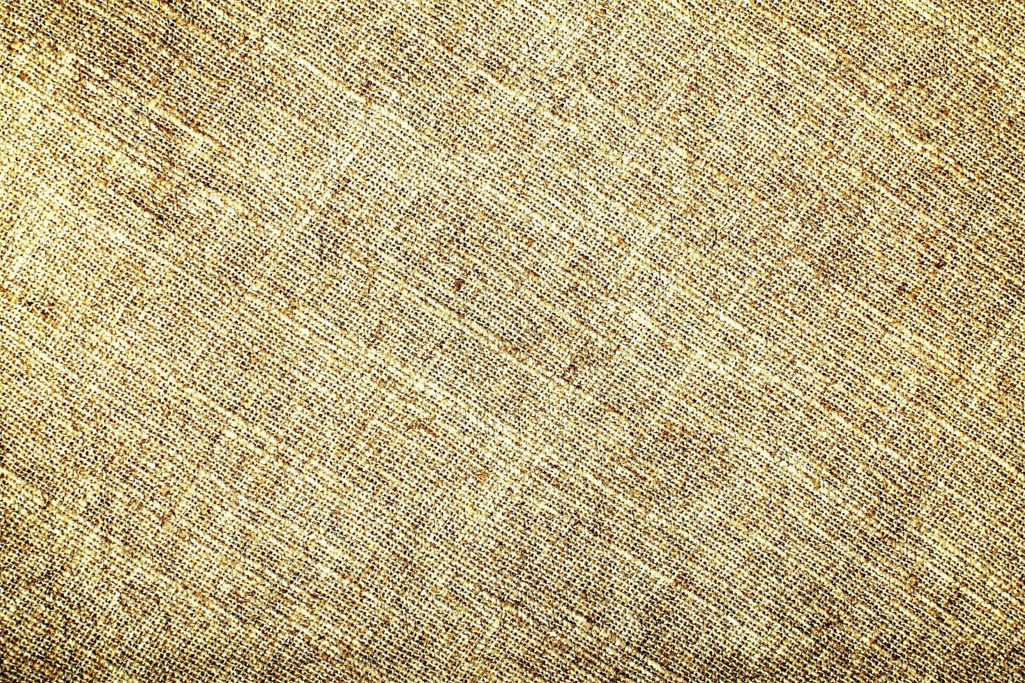 Natural Linen Material Textile Canvas Fabric Texture Background Close-up Detail of Fabric Natural Color Hemp Material Pattern Design Wallpaper. Can be Used as Background or For Graphic Design photo