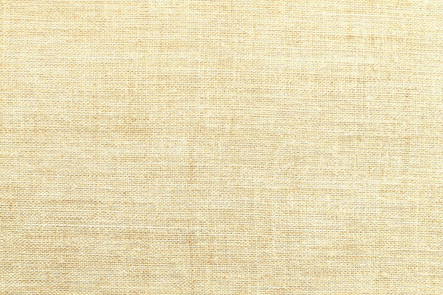 Natural Linen Material Textile Canvas Fabric Texture Background Close-up Detail of Fabric Natural Color Hemp Material Pattern Design Wallpaper. Can be Used as Background or For Graphic Design photo