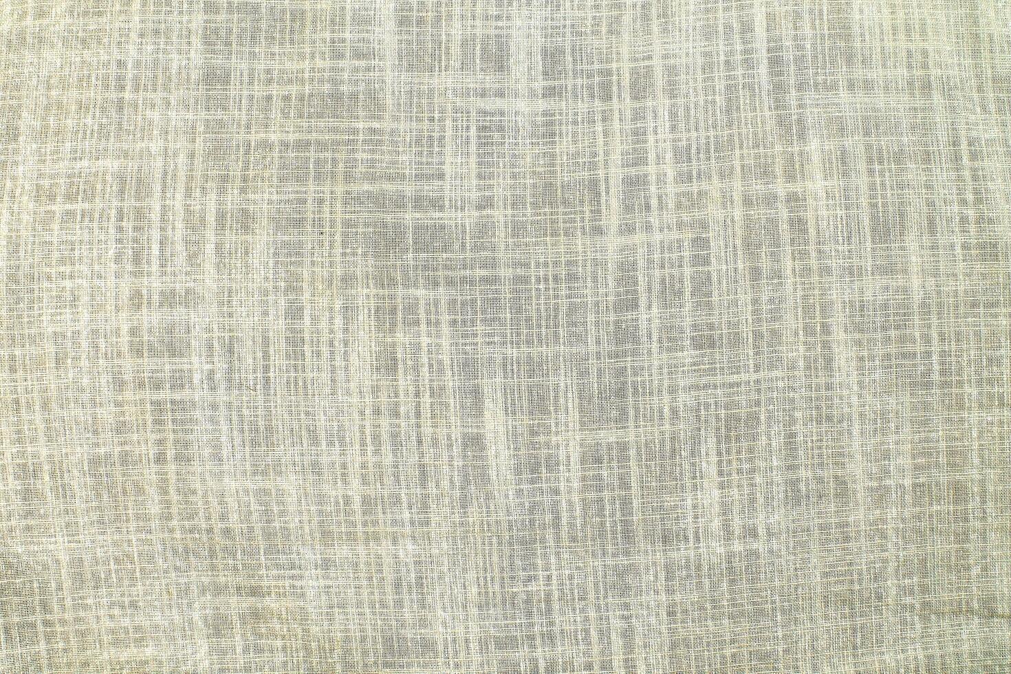 Natural Linen Material Textile Canvas Fabric Texture Background Close-up Detail of Fabric Natural Color Hemp Material Pattern Design Wallpaper. Can be Used as Background or For Graphic Design photo