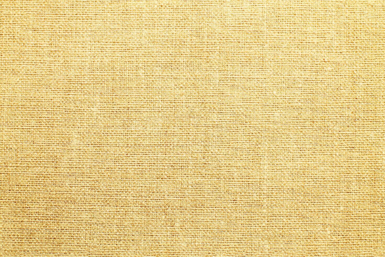 Natural Linen Material Textile Canvas Fabric Texture Background Close-up Detail of Fabric Natural Color Hemp Material Pattern Design Wallpaper. Can be Used as Background or For Graphic Design photo