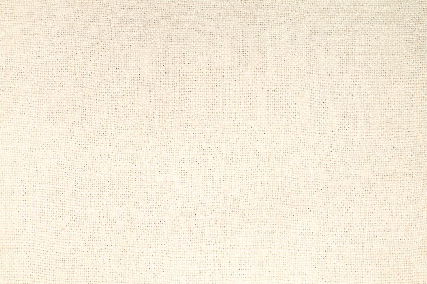 Natural Linen Material Textile Canvas Fabric Texture Background Close-up Detail of Fabric Natural Color Hemp Material Pattern Design Wallpaper. Can be Used as Background or For Graphic Design photo