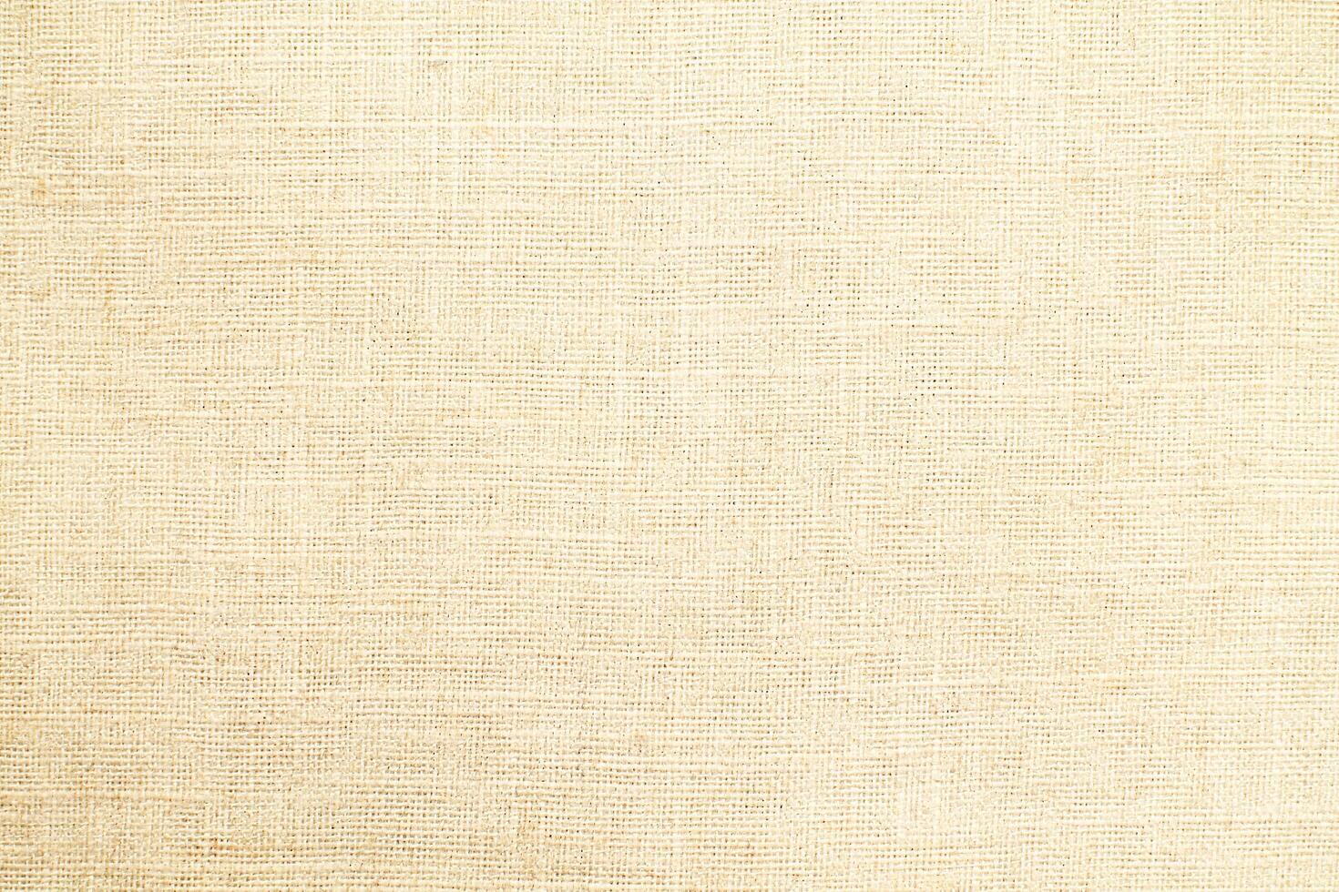 Natural Linen Material Textile Canvas Fabric Texture Background Close-up Detail of Fabric Natural Color Hemp Material Pattern Design Wallpaper. Can be Used as Background or For Graphic Design photo