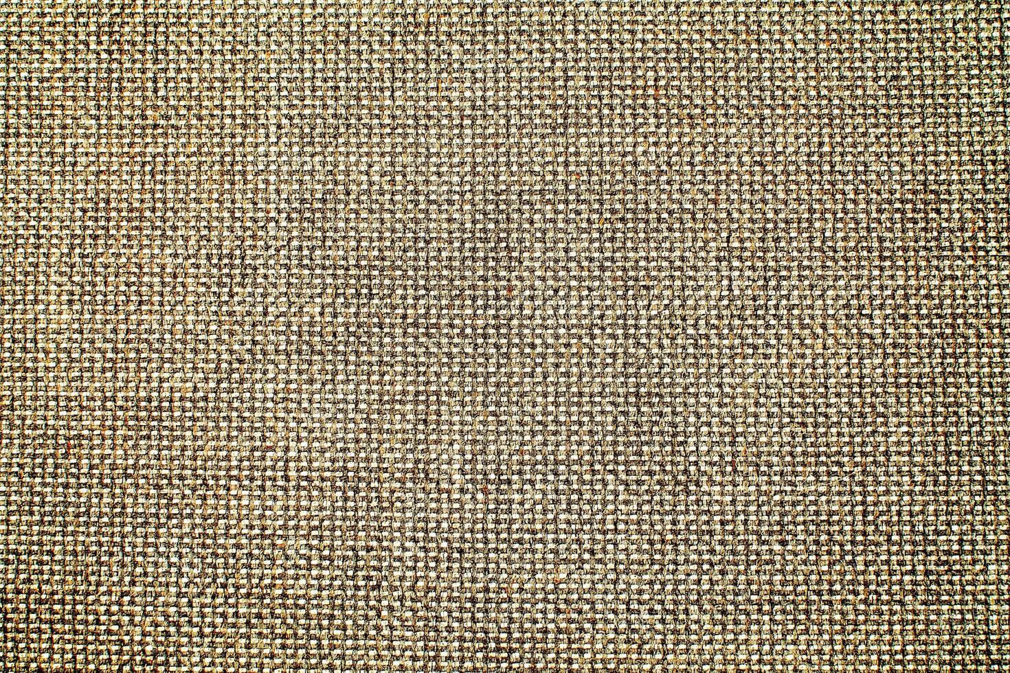 Natural Linen Material Textile Canvas Fabric Texture Background Close-up Detail of Fabric Natural Color Hemp Material Pattern Design Wallpaper. Can be Used as Background or For Graphic Design photo