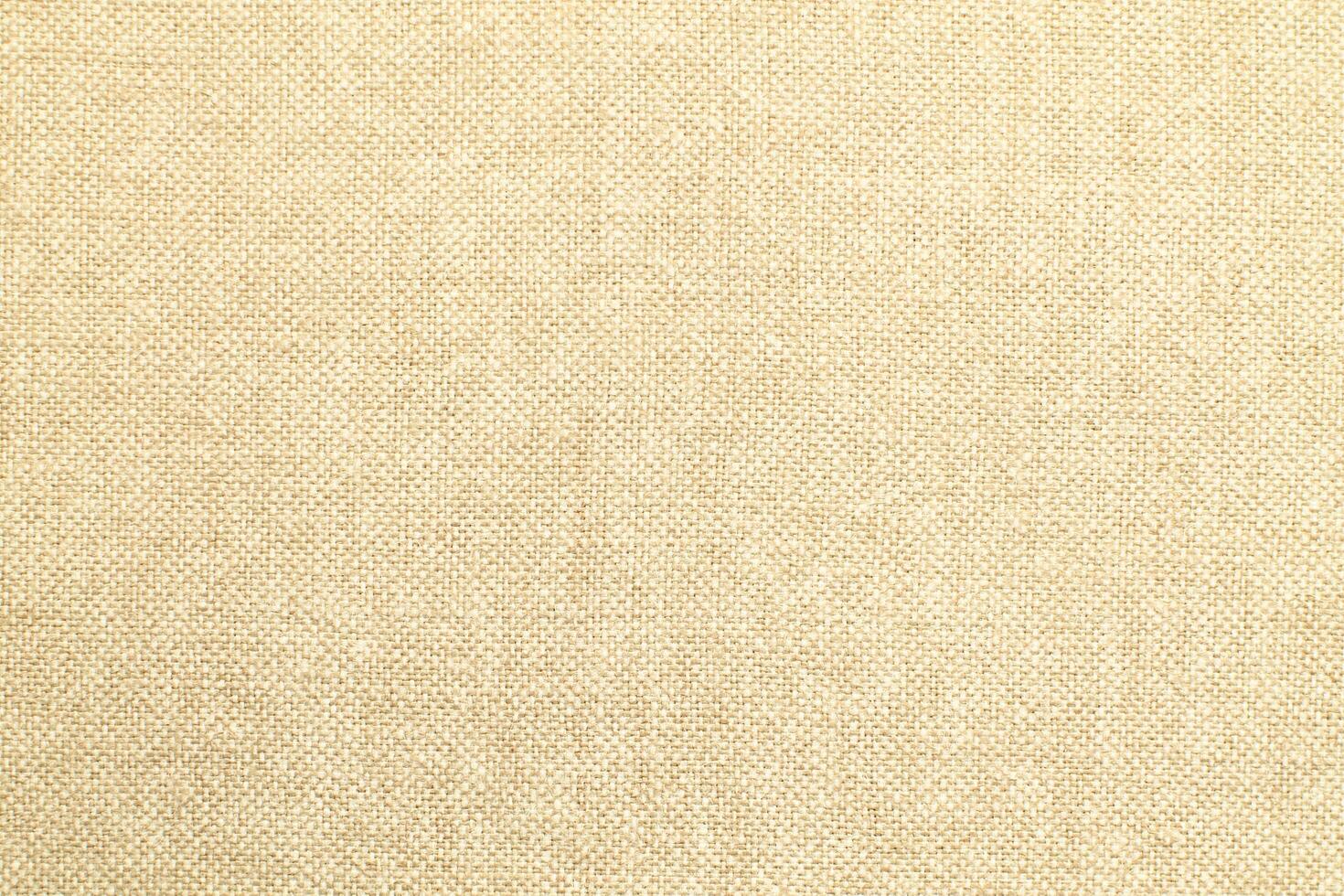 Natural Linen Material Textile Canvas Fabric Texture Background Close-up Detail of Fabric Natural Color Hemp Material Pattern Design Wallpaper. Can be Used as Background or For Graphic Design photo