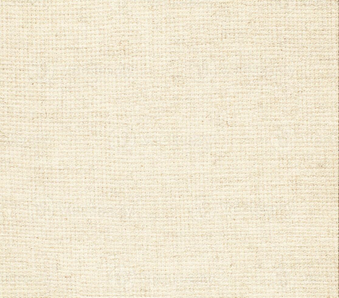 Natural Linen Material Textile Canvas Fabric Texture Background Close-up Detail of Fabric Natural Color Hemp Material Pattern Design Wallpaper. Can be Used as Background or For Graphic Design photo