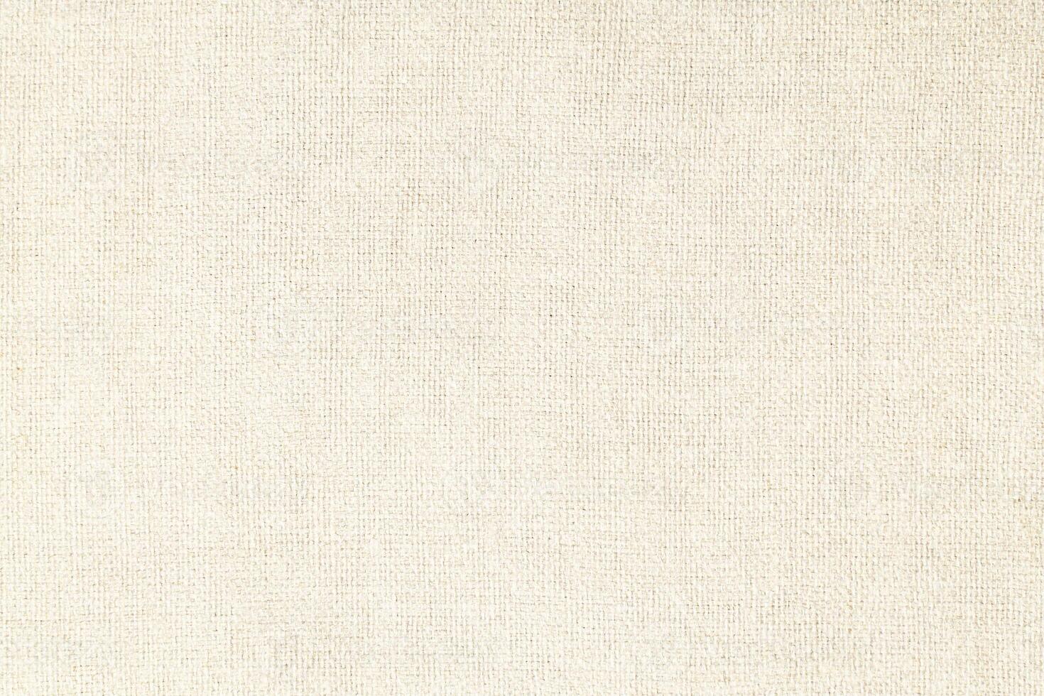 Natural Linen Material Textile Canvas Fabric Texture Background Close-up Detail of Fabric Natural Color Hemp Material Pattern Design Wallpaper. Can be Used as Background or For Graphic Design photo