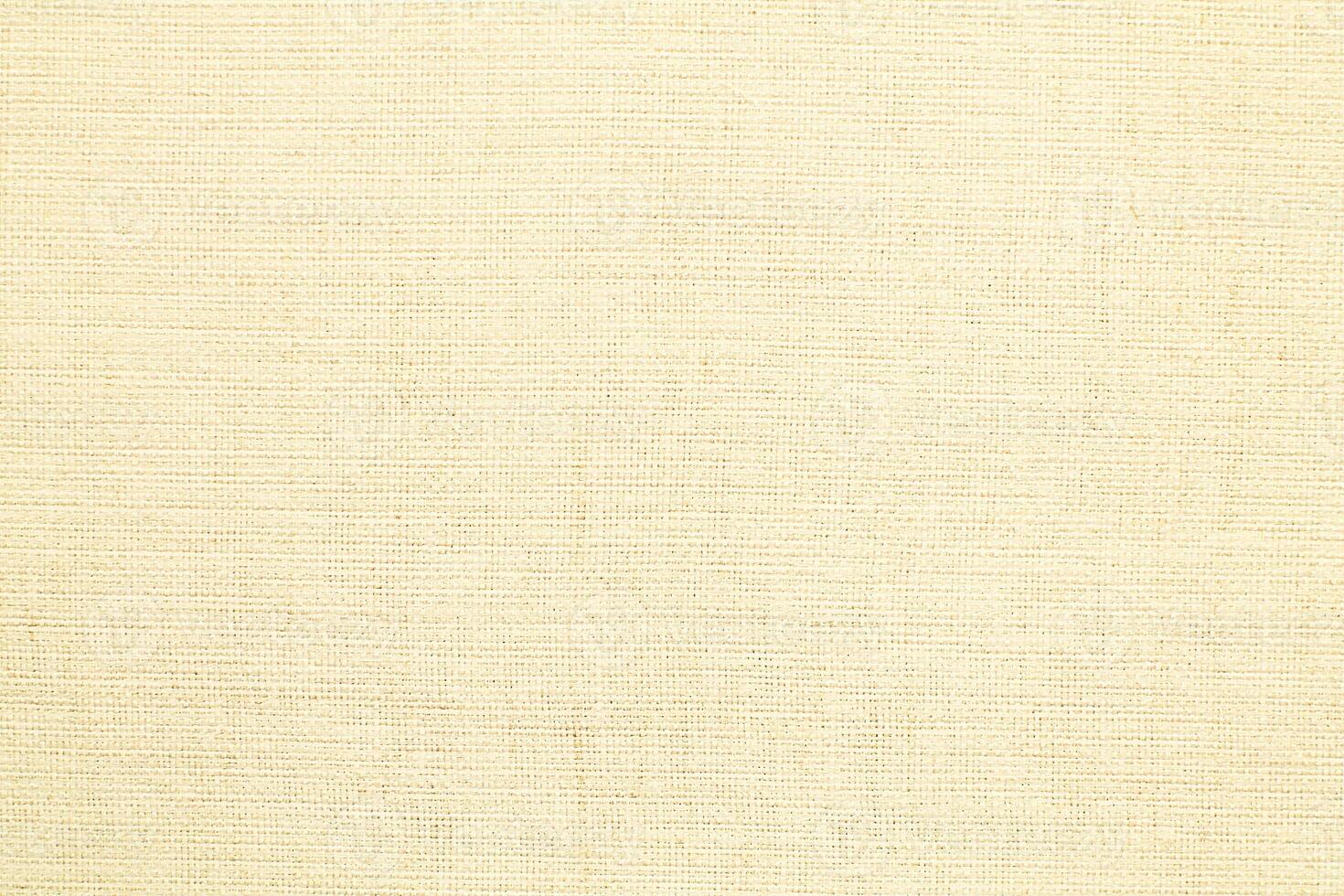 Natural Linen Material Textile Canvas Fabric Texture Background Close-up Detail of Fabric Natural Color Hemp Material Pattern Design Wallpaper. Can be Used as Background or For Graphic Design photo