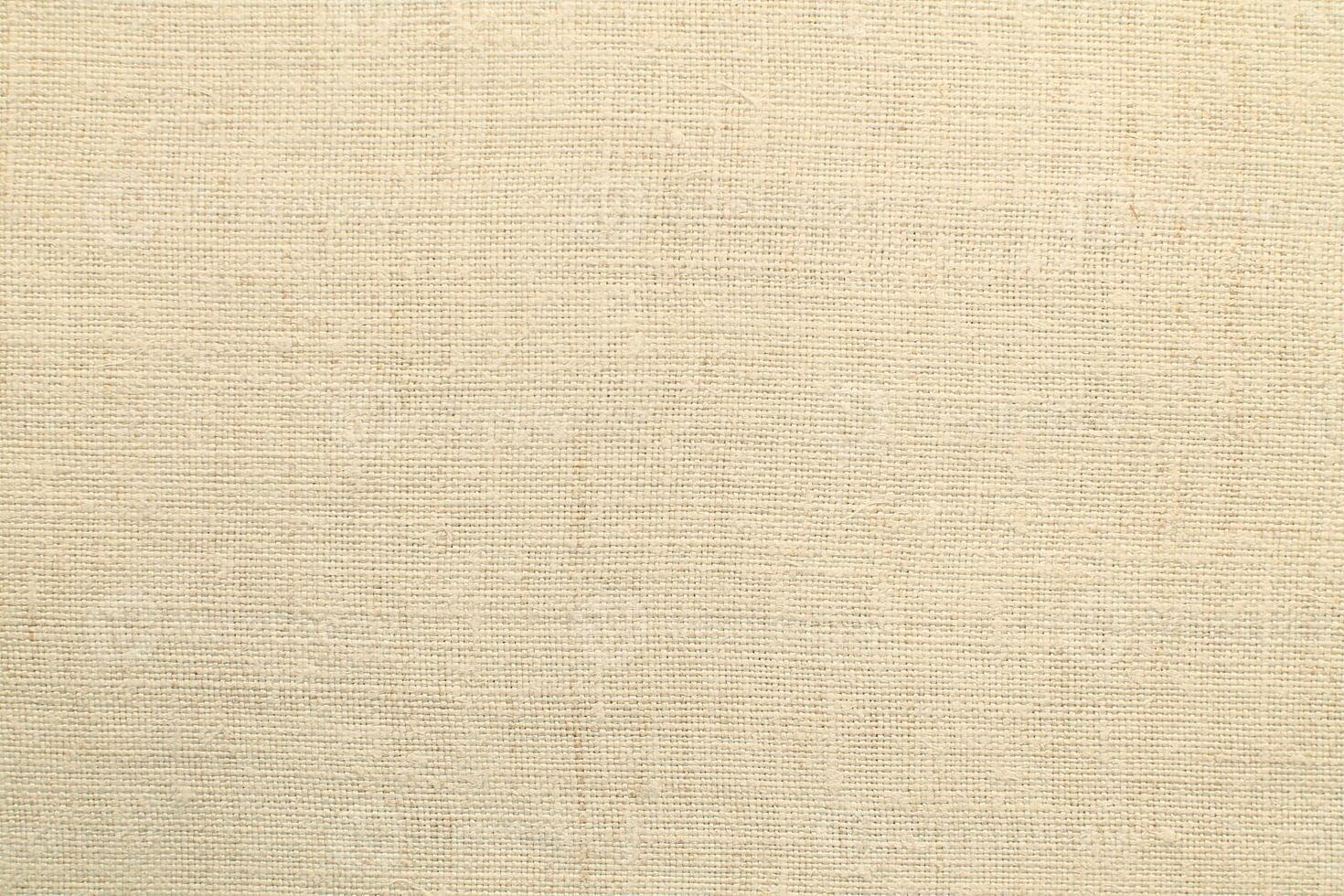 Natural Linen Material Textile Canvas Fabric Texture Background Close-up Detail of Fabric Natural Color Hemp Material Pattern Design Wallpaper. Can be Used as Background or For Graphic Design photo