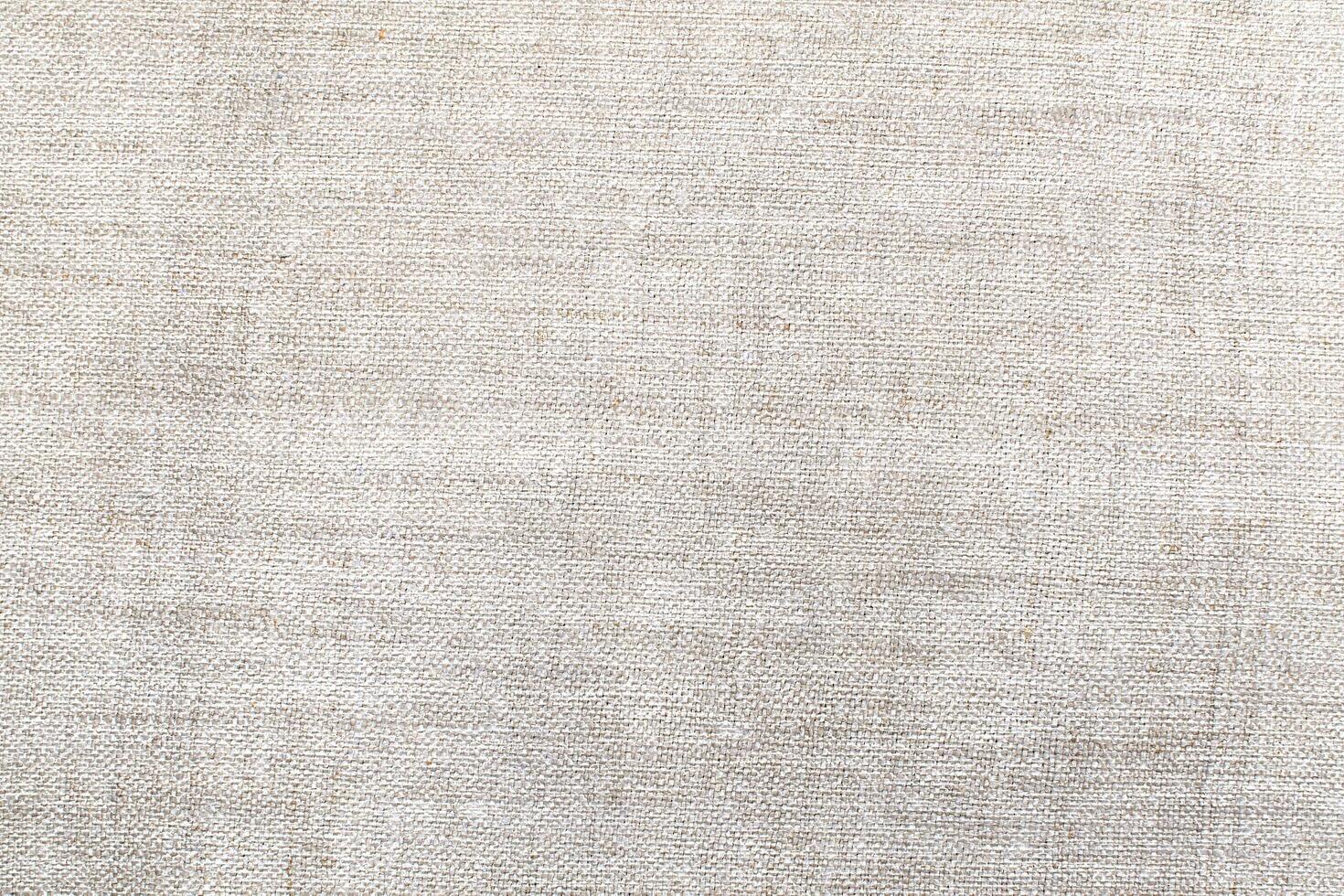 Natural Linen Material Textile Canvas Fabric Texture Background Close-up Detail of Fabric Natural Color Hemp Material Pattern Design Wallpaper. Can be Used as Background or For Graphic Design photo