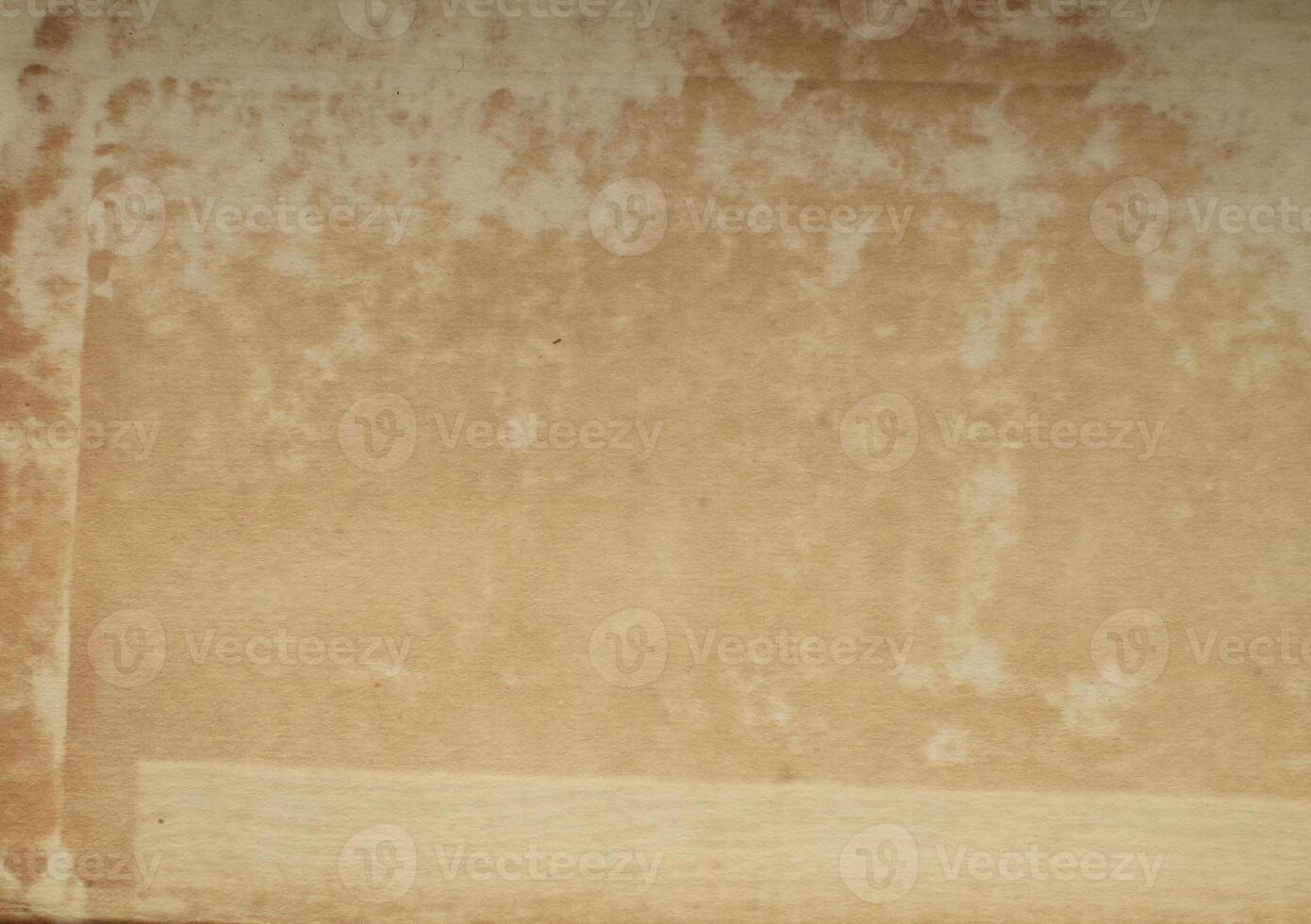 A brown paper bag with a piece of paper inside photo